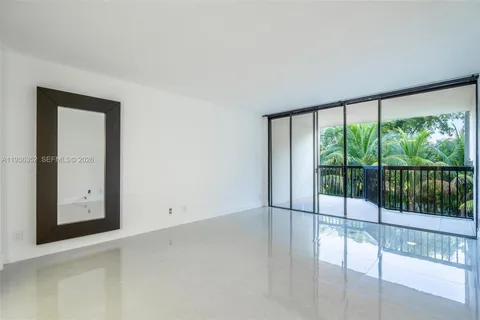 a bathroom with a double vanity sink mirror and shower