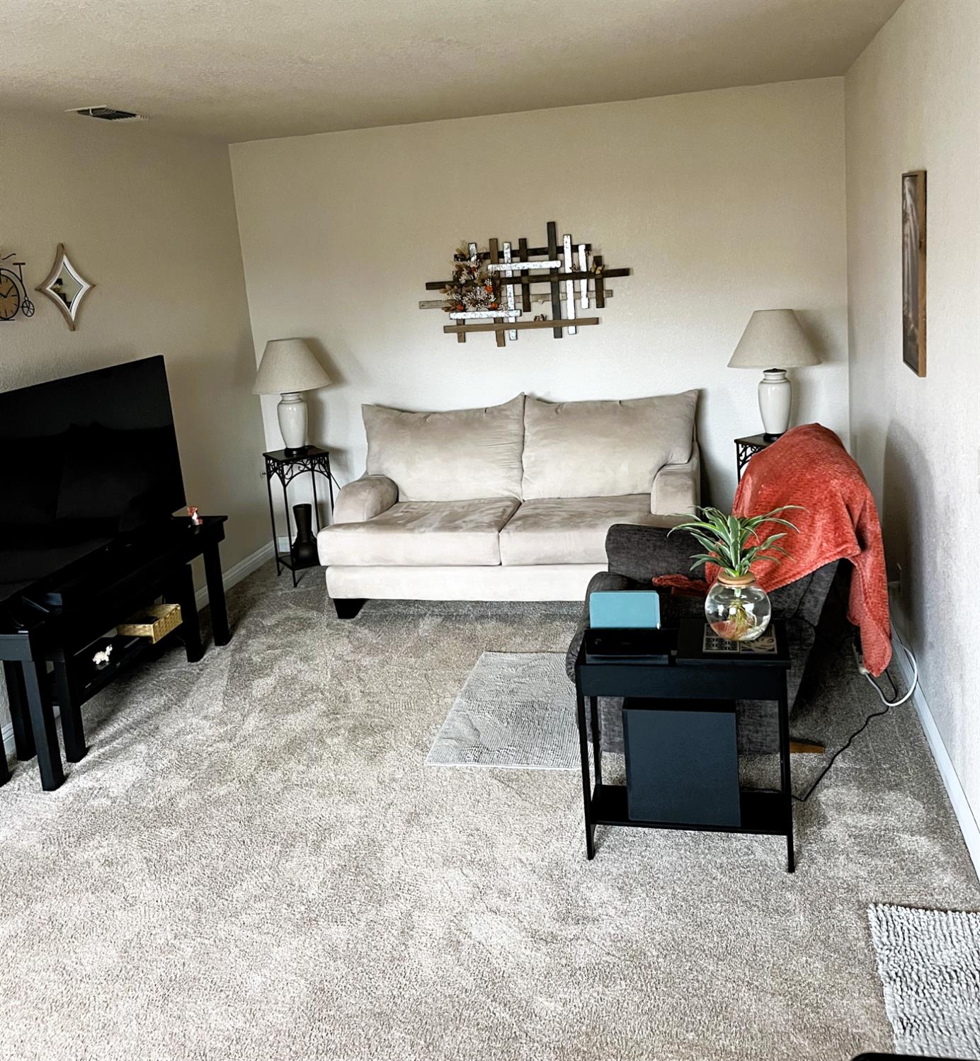 113 Atkinson Street Roseville, CA 95678 - Photo 5 of 22 a living room with furniture and a flat screen tv