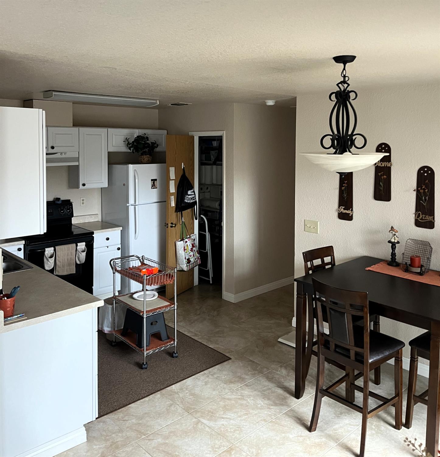 113 Atkinson Street Roseville, CA 95678 - Photo 7 of 22 a view of a dining room with furniture and chandelier