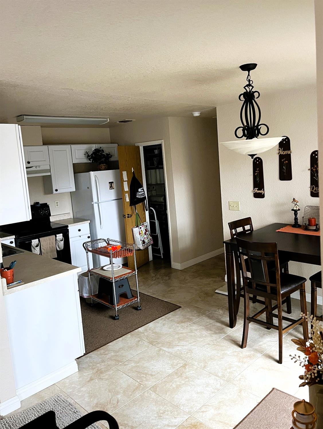 113 Atkinson Street Roseville, CA 95678 - Photo 8 of 22 a living room with furniture and a chandelier