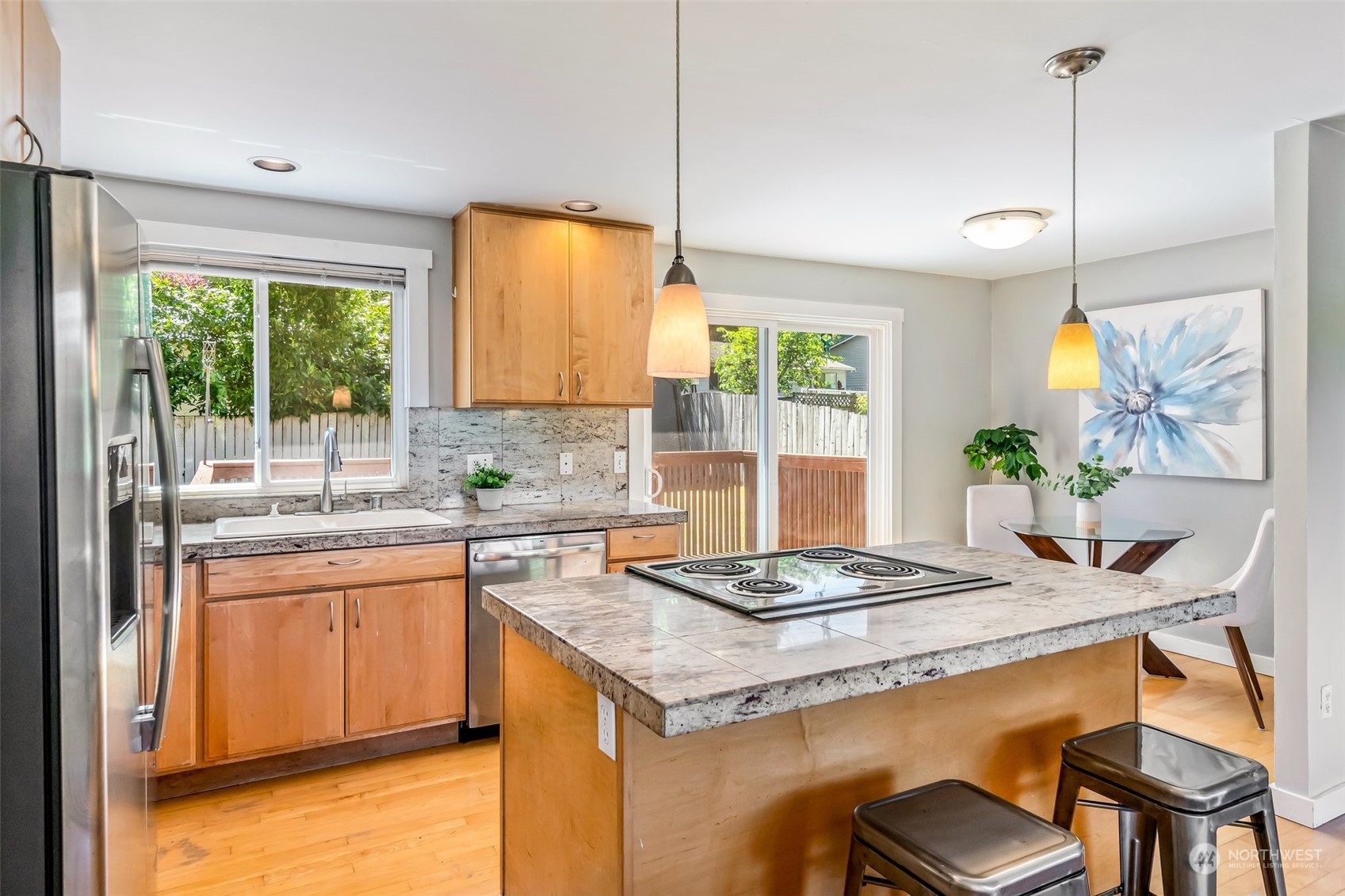 612 219th Place Southwest Bothell, WA 98021 - Photo 10 of 32 a kitchen with a stove a sink a table and chairs