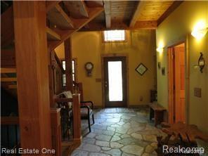 9895 Gibbs Road Clarkston, MI 48348 - Photo 13 of 75 Custom Entry Foyer with stone flooring.