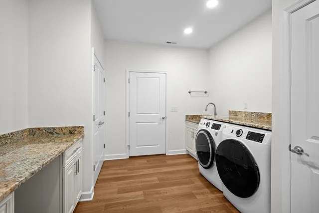 a view of storage and utility room with washer and dryer