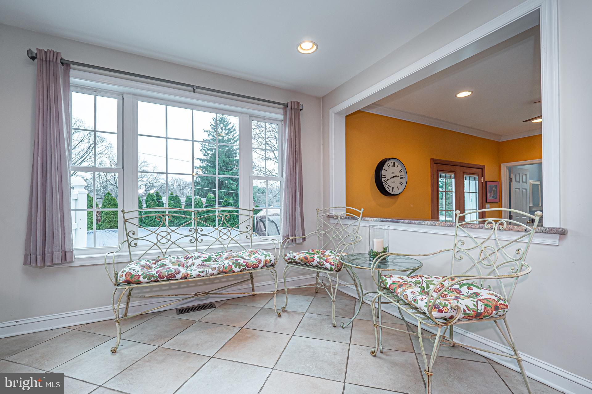 929 Westfield Road Springfield, PA 19064 - Photo 14 of 28 a living room with furniture and floor to ceiling windows