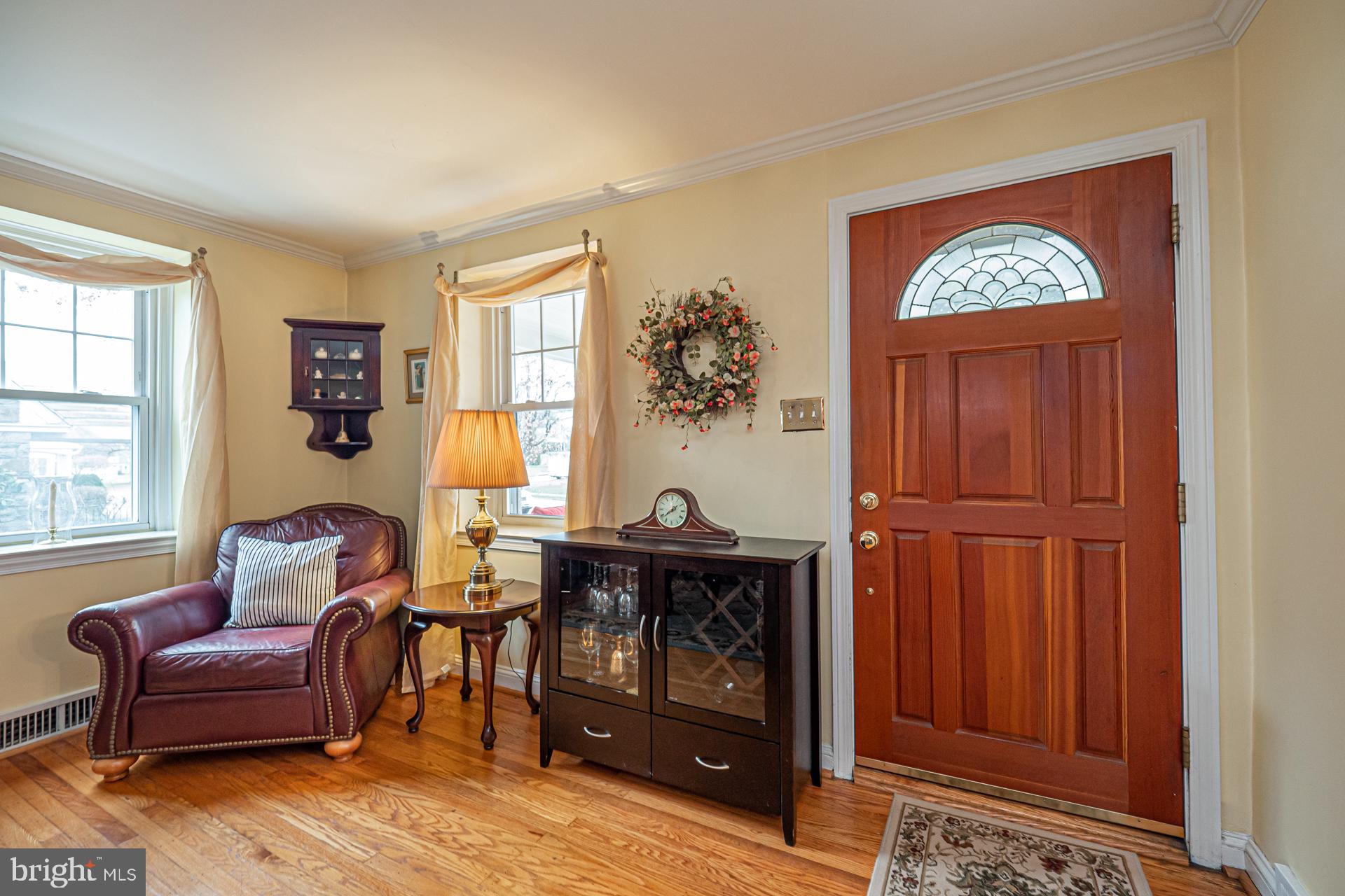 929 Westfield Road Springfield, PA 19064 - Photo 3 of 28 a living room with furniture a table and a window