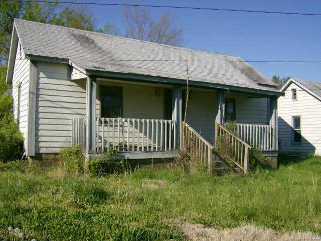 553 Cavel Chub Lake Road Roxboro, NC 27573 - Photo 1 of 2 a view of a house with a small yard and wooden fence