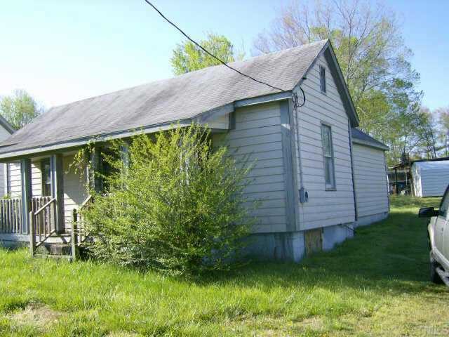 553 Cavel Chub Lake Road Roxboro, NC 27573 - Photo 2 of 2 a backyard of a house with lots of green space