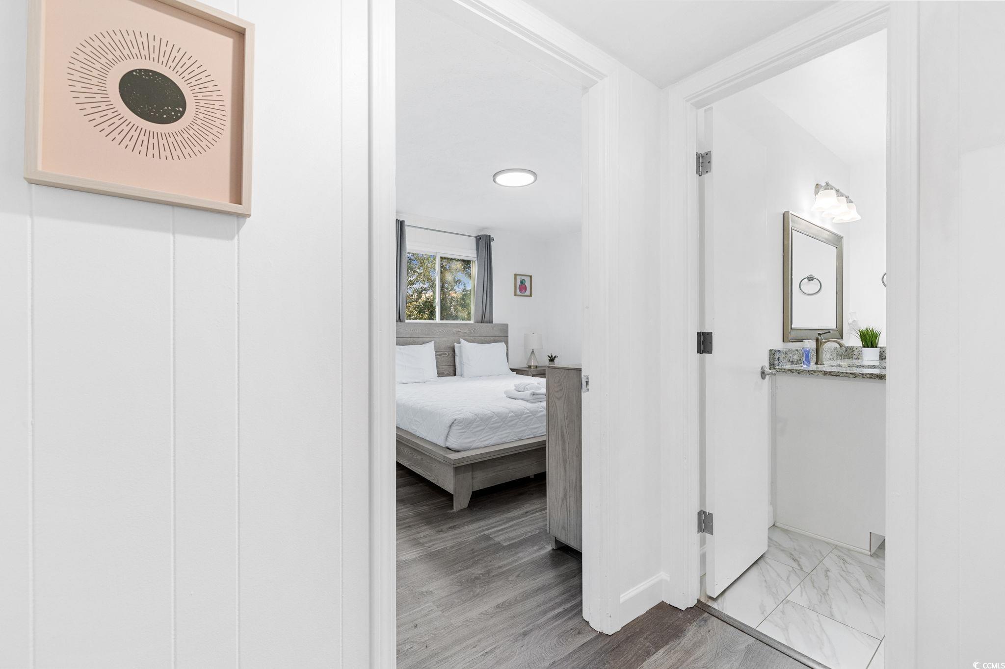 409 17th Avenue North, Unit 3 Myrtle Beach, SC 29577 - Photo 13 of 16 Hall featuring light wood-style floors