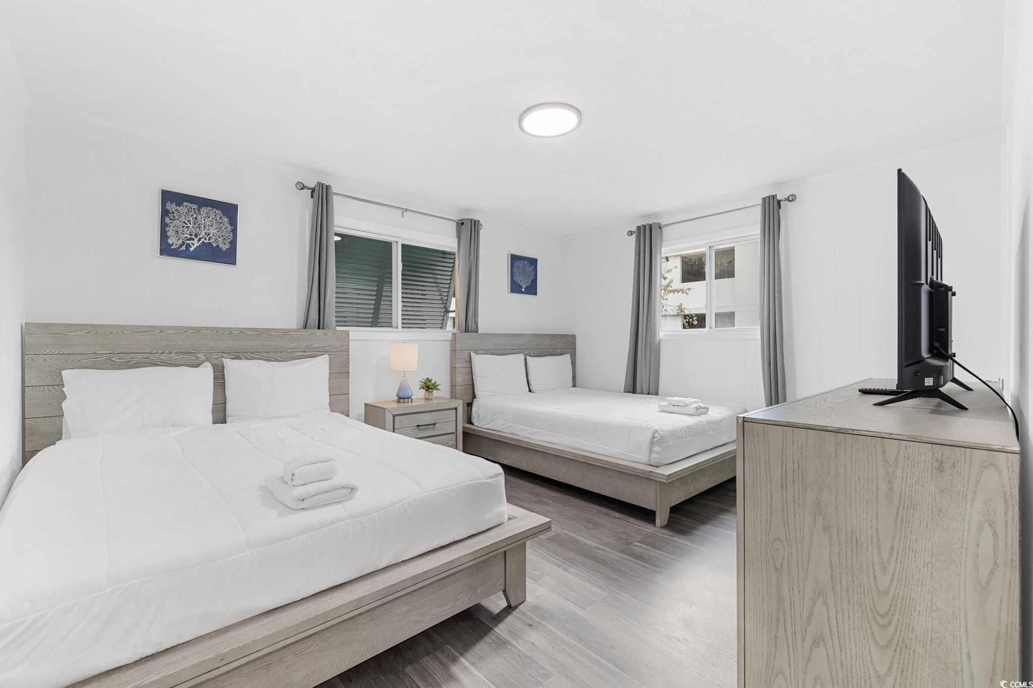 409 17th Avenue North, Unit 3 Myrtle Beach, SC 29577 - Photo 3 of 16 Bedroom with wood finished floors