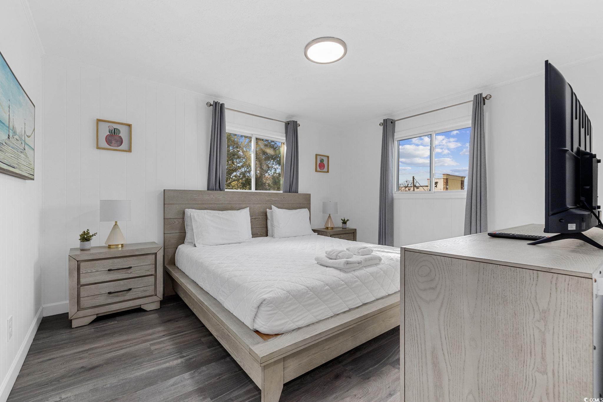 409 17th Avenue North, Unit 3 Myrtle Beach, SC 29577 - Photo 5 of 16 Bedroom featuring wood finished floors and baseboards