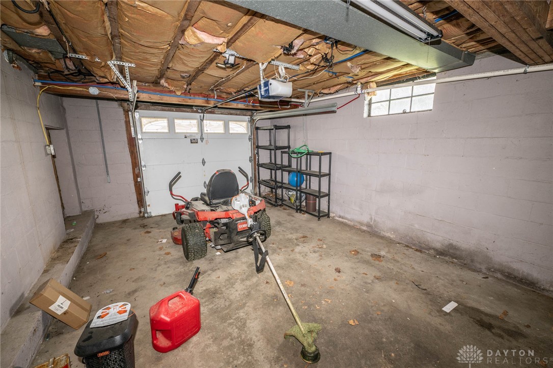 190 Swailes Road Troy, OH 45373 - Photo 82 of 82 This functional garage offers practical space for storage and vehicle parking.