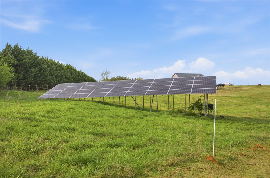 426 Oak Creek Road Seneca, SC 29678 - Photo 39 of 50 This property features efficient photovoltaics within a spacious yard, offering sustainable living.