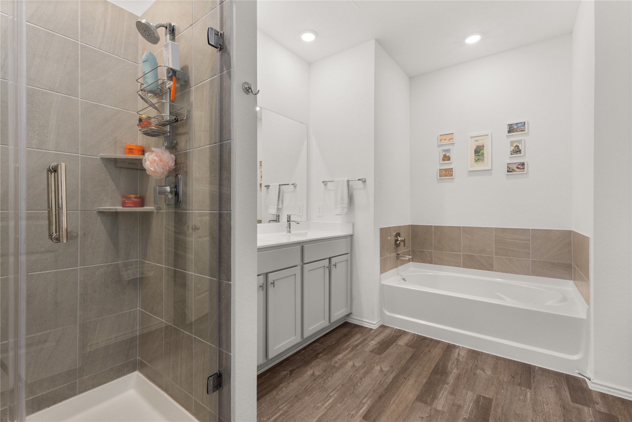 18771 Goldbach Road New Caney, TX 77357 - Photo 18 of 38 This inviting primary bathroom features a sleek glass-enclosed shower, a spacious soaker tub, dual sinks and additional storage.