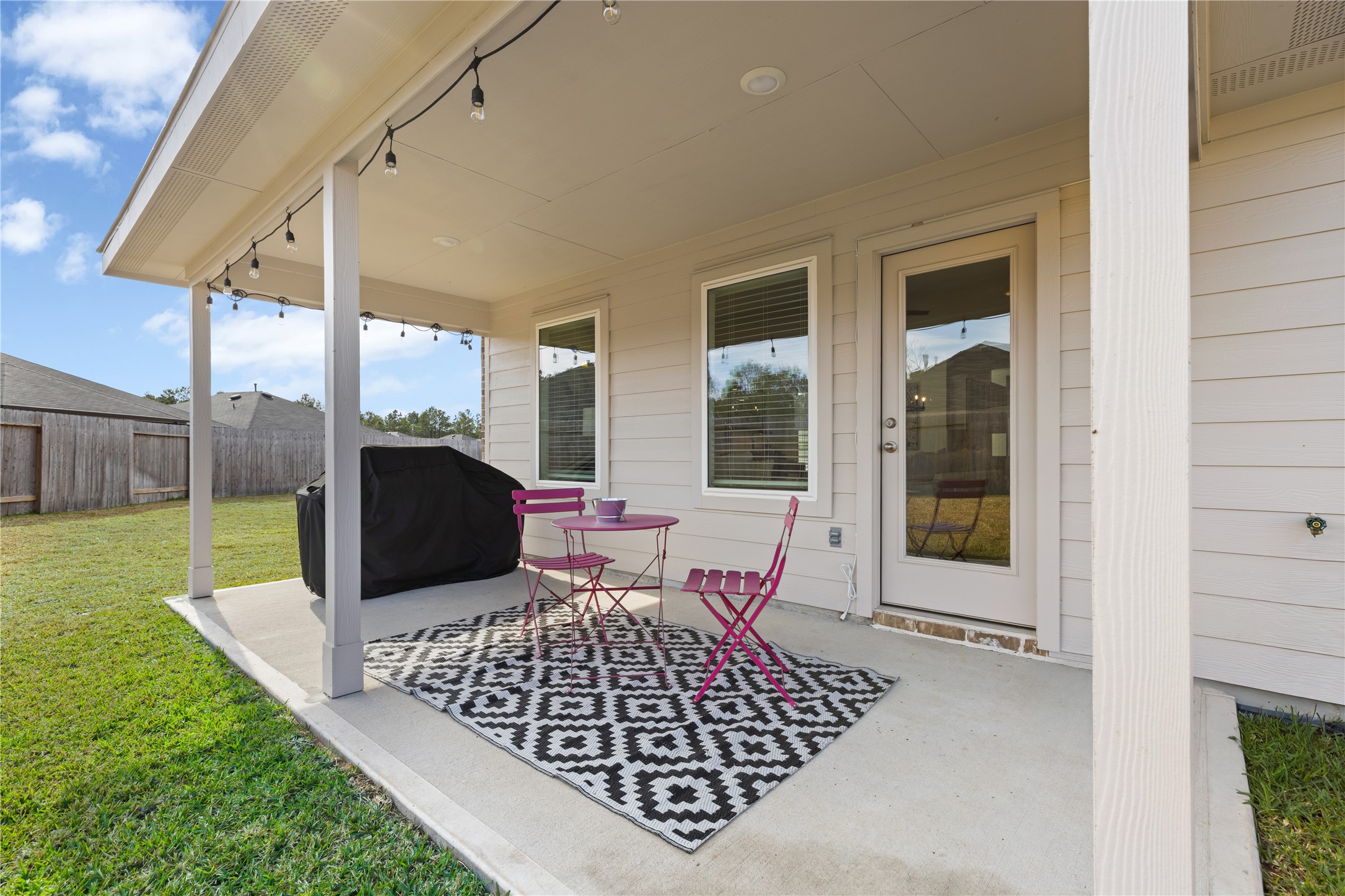 18771 Goldbach Road New Caney, TX 77357 - Photo 31 of 38 This covered extended porch perfect for relaxing or entertaining!