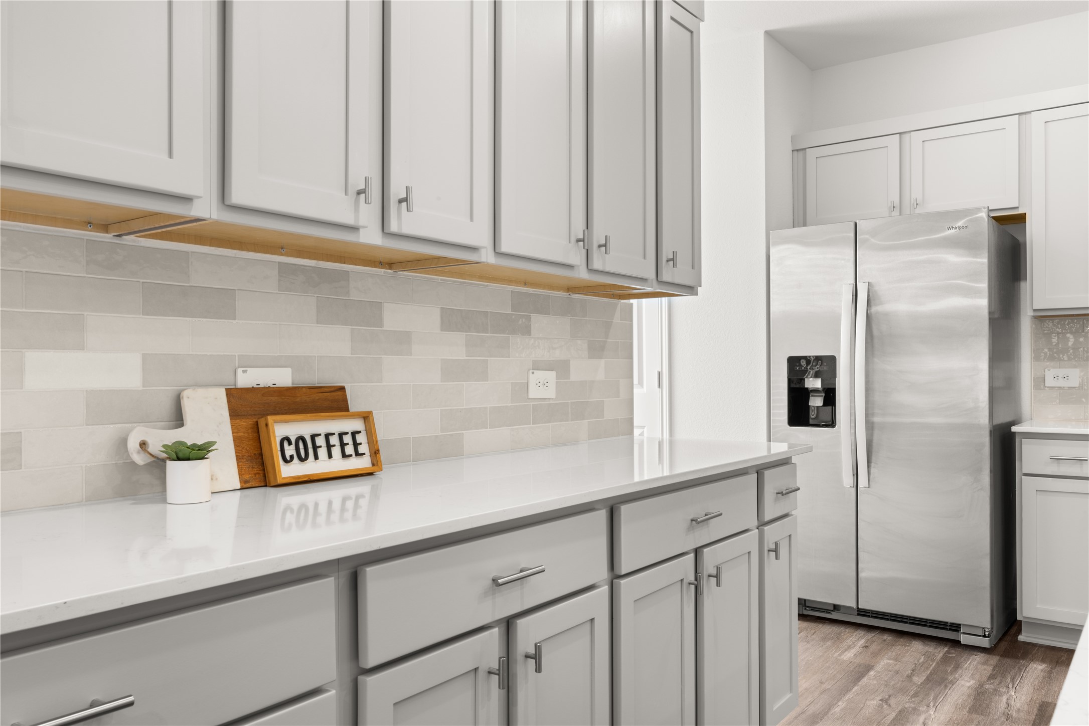 18771 Goldbach Road New Caney, TX 77357 - Photo 6 of 38 Stylish subway tile backsplash blends beautifully with the cabinets. Fridge included.