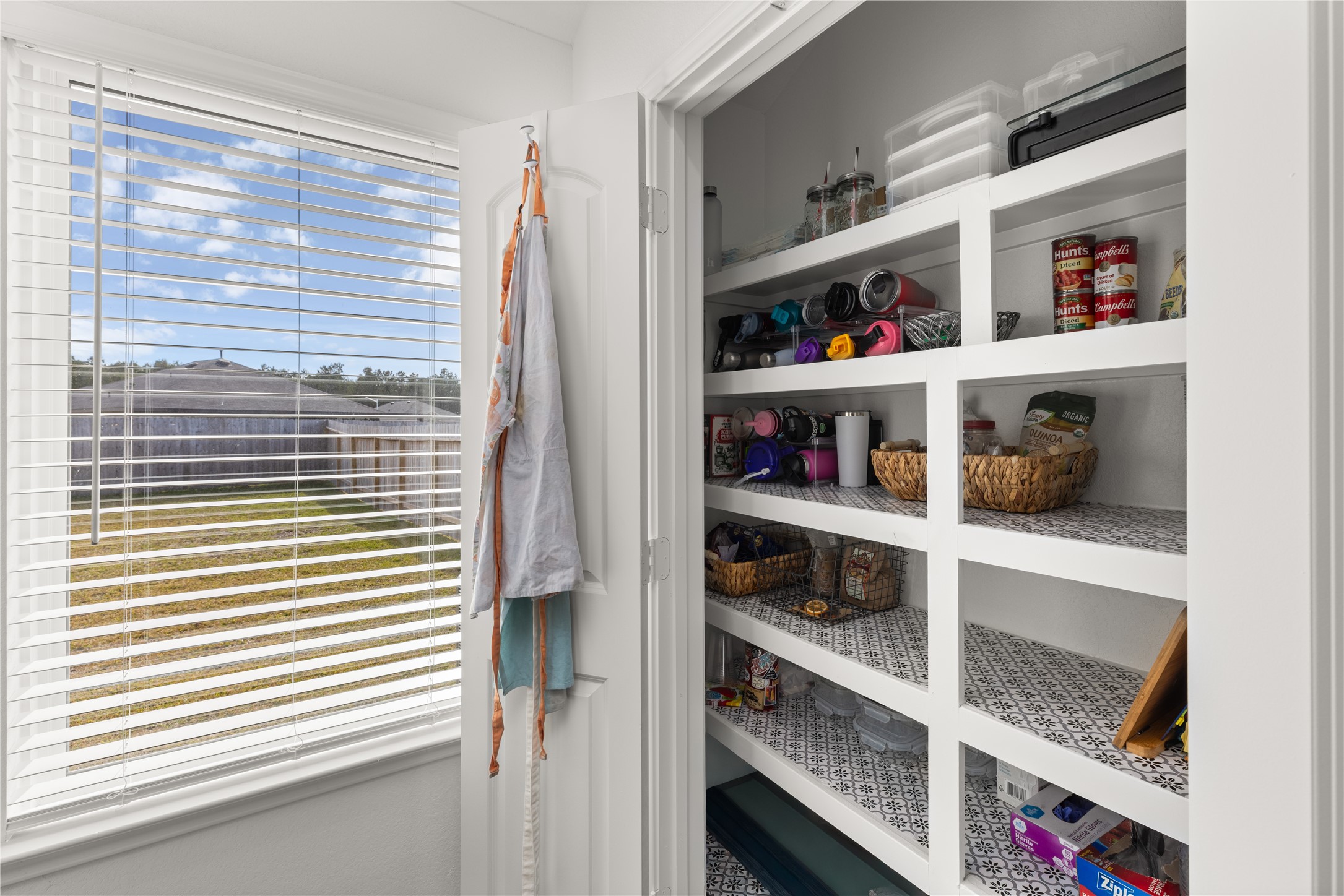 18771 Goldbach Road New Caney, TX 77357 - Photo 9 of 38 Discover the convenience of a spacious pantry adjacent to a roomy laundry area!