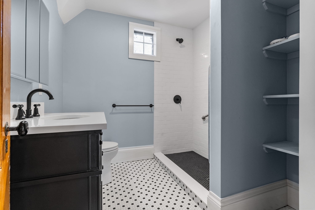 16 Pleasant Street Wakefield, MA 01880 - Photo 18 of 22 a bathroom with a sink and a mirror