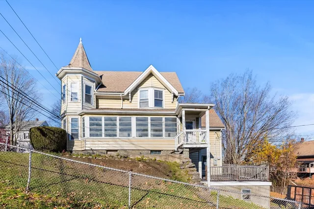 a front view of a house with yard