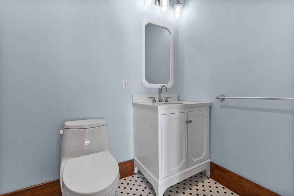 16 Pleasant Street Wakefield, MA 01880 - Photo 10 of 22 a bathroom with a toilet and a sink