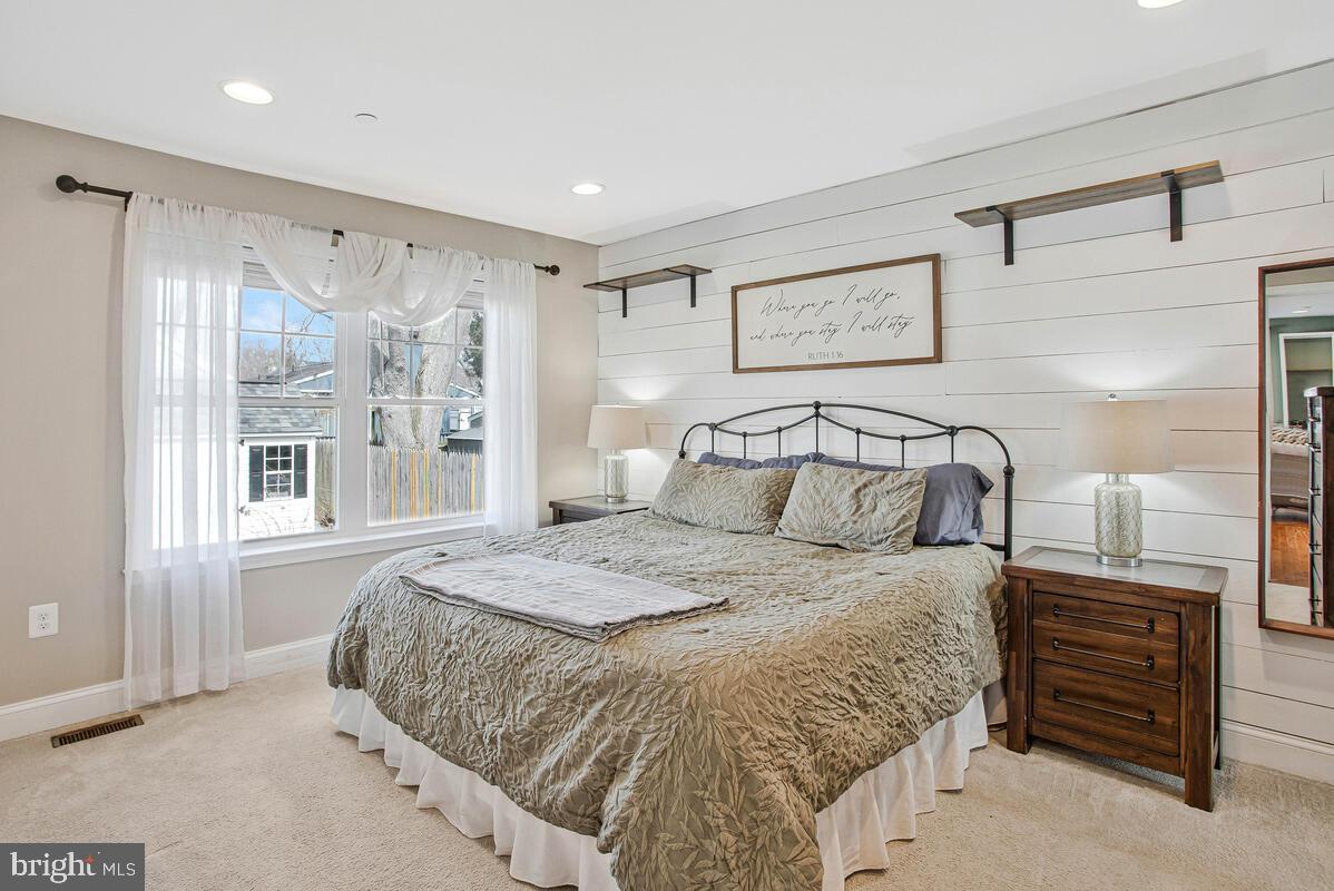 1168 Maple Avenue Shady Side, MD 20764 - Photo 18 of 52 Serene bedroom with natural light and charm.