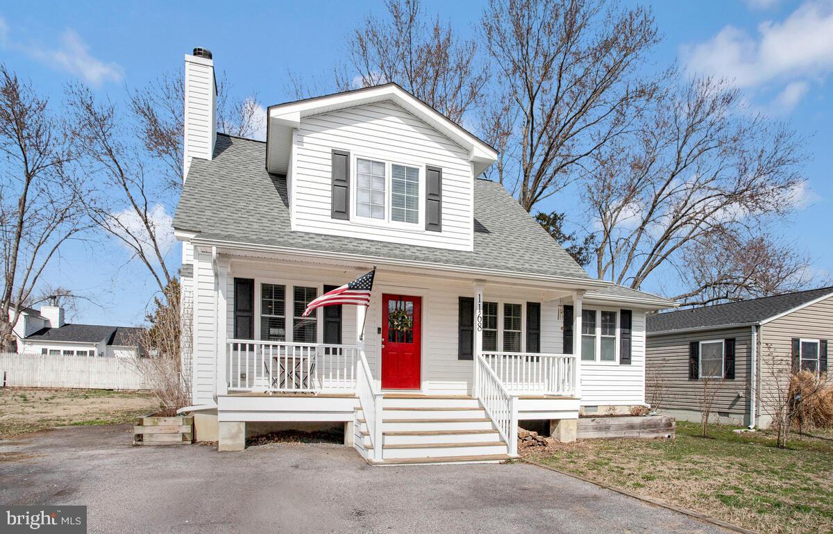 1168 Maple Avenue Shady Side, MD 20764 - Photo 3 of 52 Charming home with a vibrant red door.