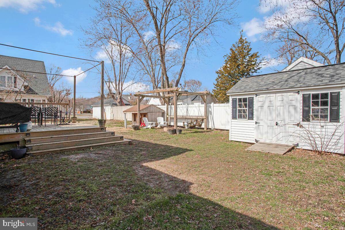 1168 Maple Avenue Shady Side, MD 20764 - Photo 32 of 52 Spacious backyard with charming shed and trees.
