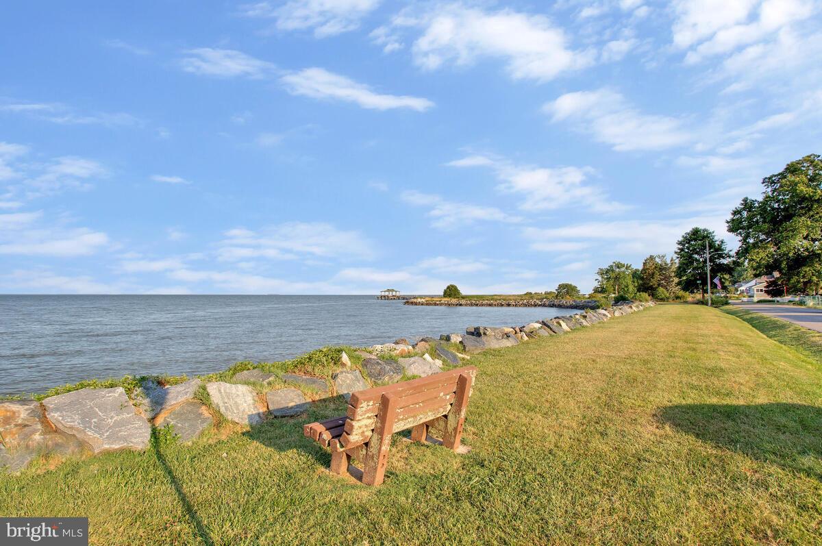 1168 Maple Avenue Shady Side, MD 20764 - Photo 46 of 52 Tranquil waterfront view with a cozy bench.