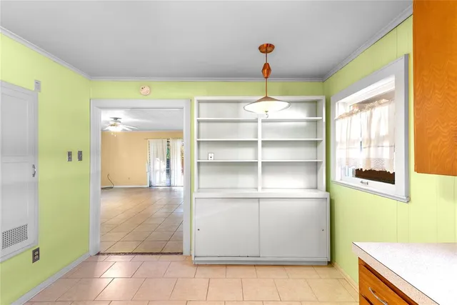 a view of a room with shelves on the wall