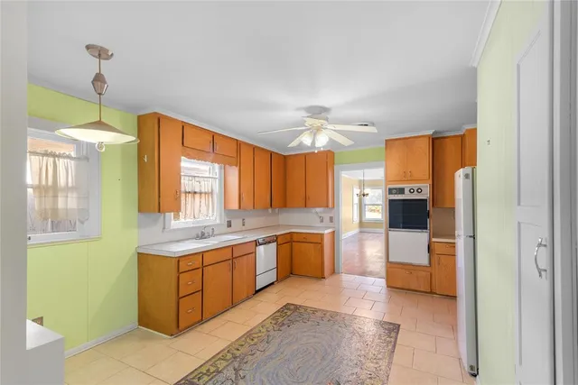 a large kitchen with a table and chairs