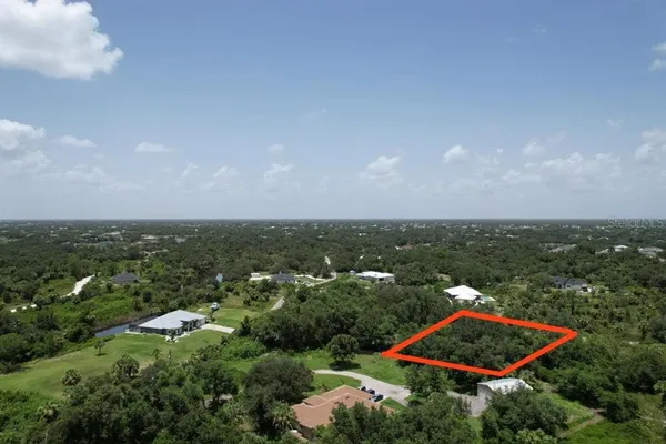 an aerial view of a residential houses with outdoor space and swimming pool