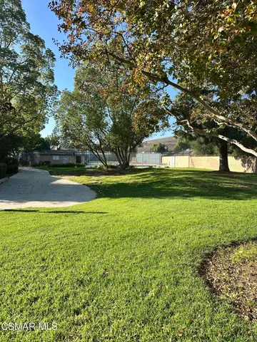 a view of a swimming pool with a garden
