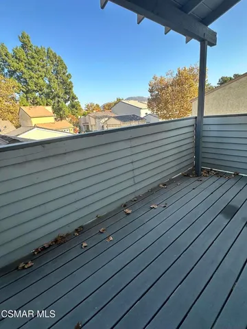 a bathroom with a granite countertop sink a mirror and shower
