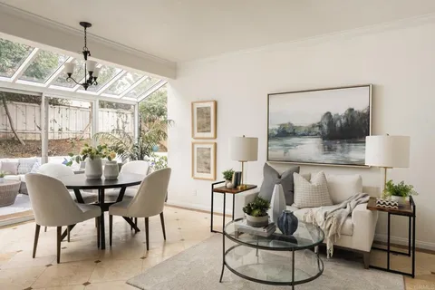 a view of a dining room with furniture window and outside view