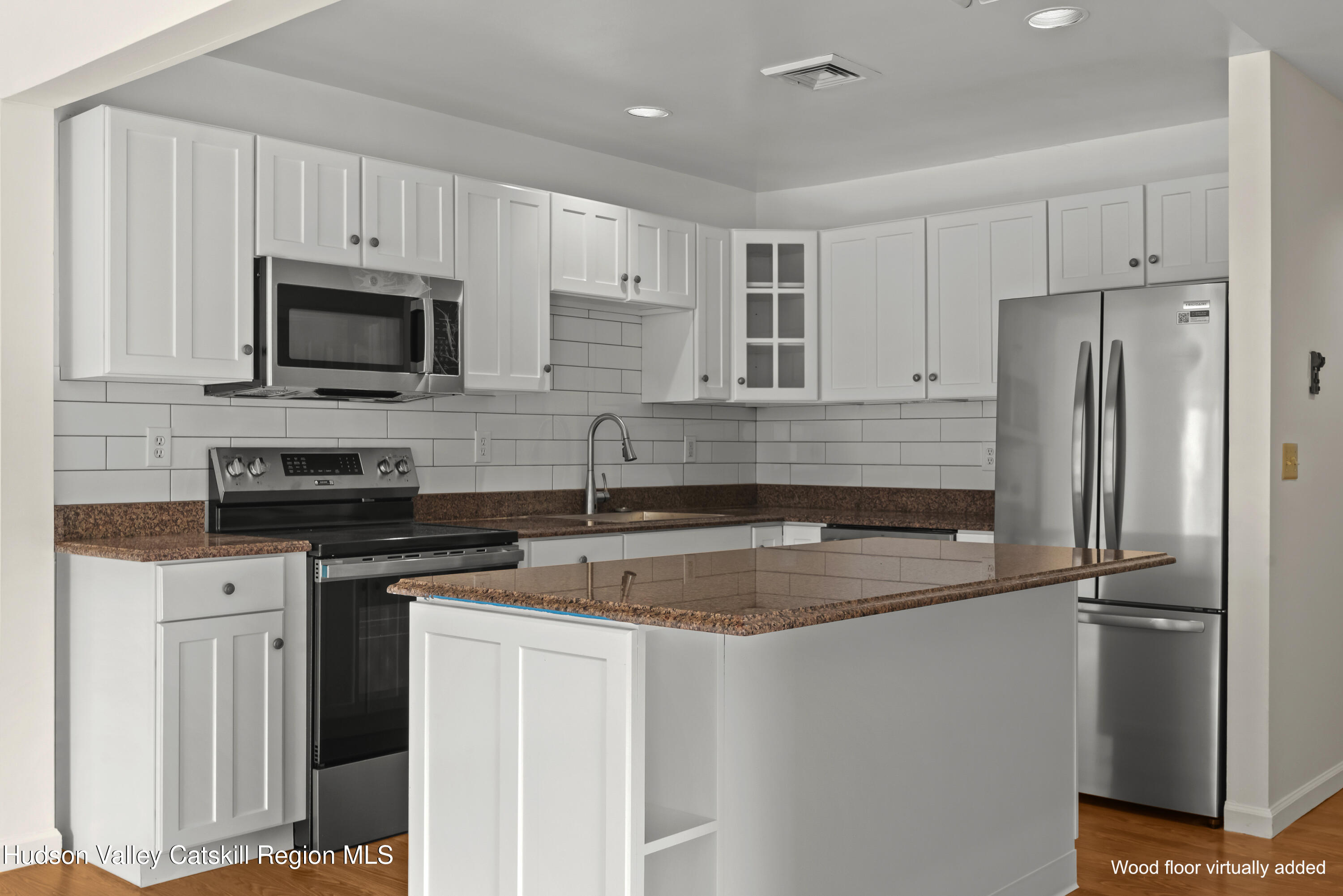 31 Pond Park Road Hurley, NY 12498 - Photo 14 of 39 a kitchen with stainless steel appliances granite countertop a refrigerator a stove a sink and white cabinets