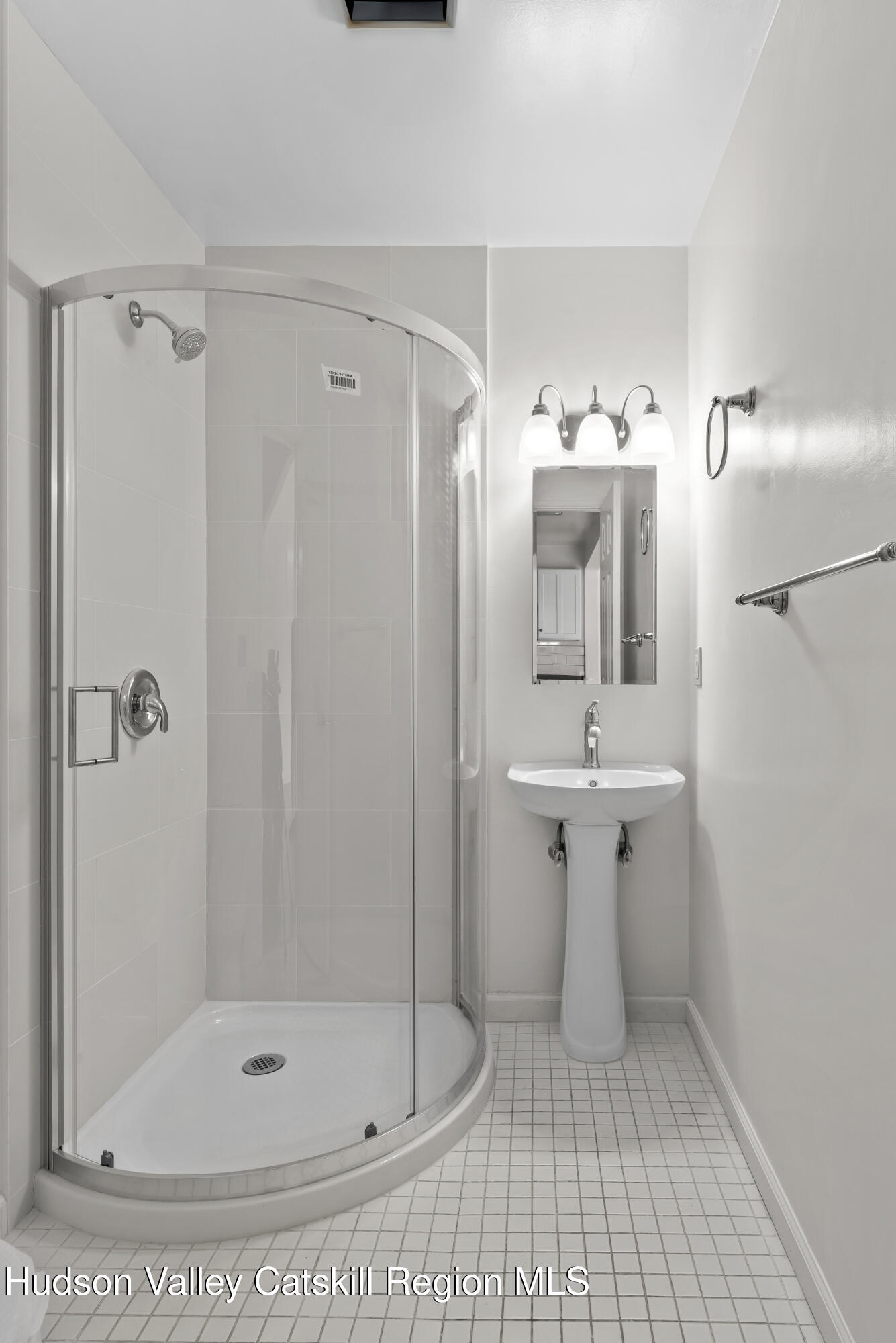 31 Pond Park Road Hurley, NY 12498 - Photo 24 of 39 a bathroom with a sink a mirror and a shower