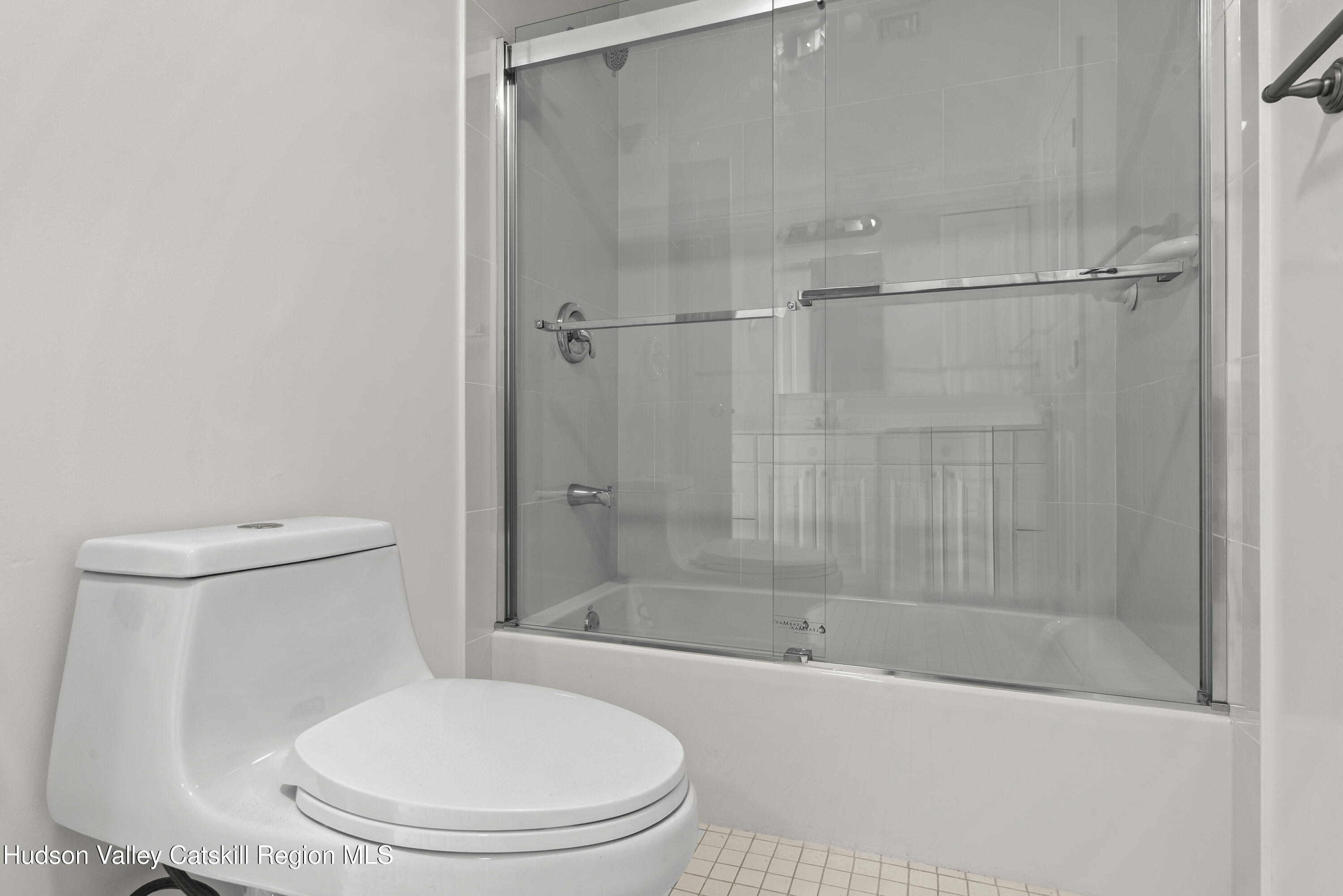31 Pond Park Road Hurley, NY 12498 - Photo 25 of 39 a white toilet sitting next to a bath tub and a shower