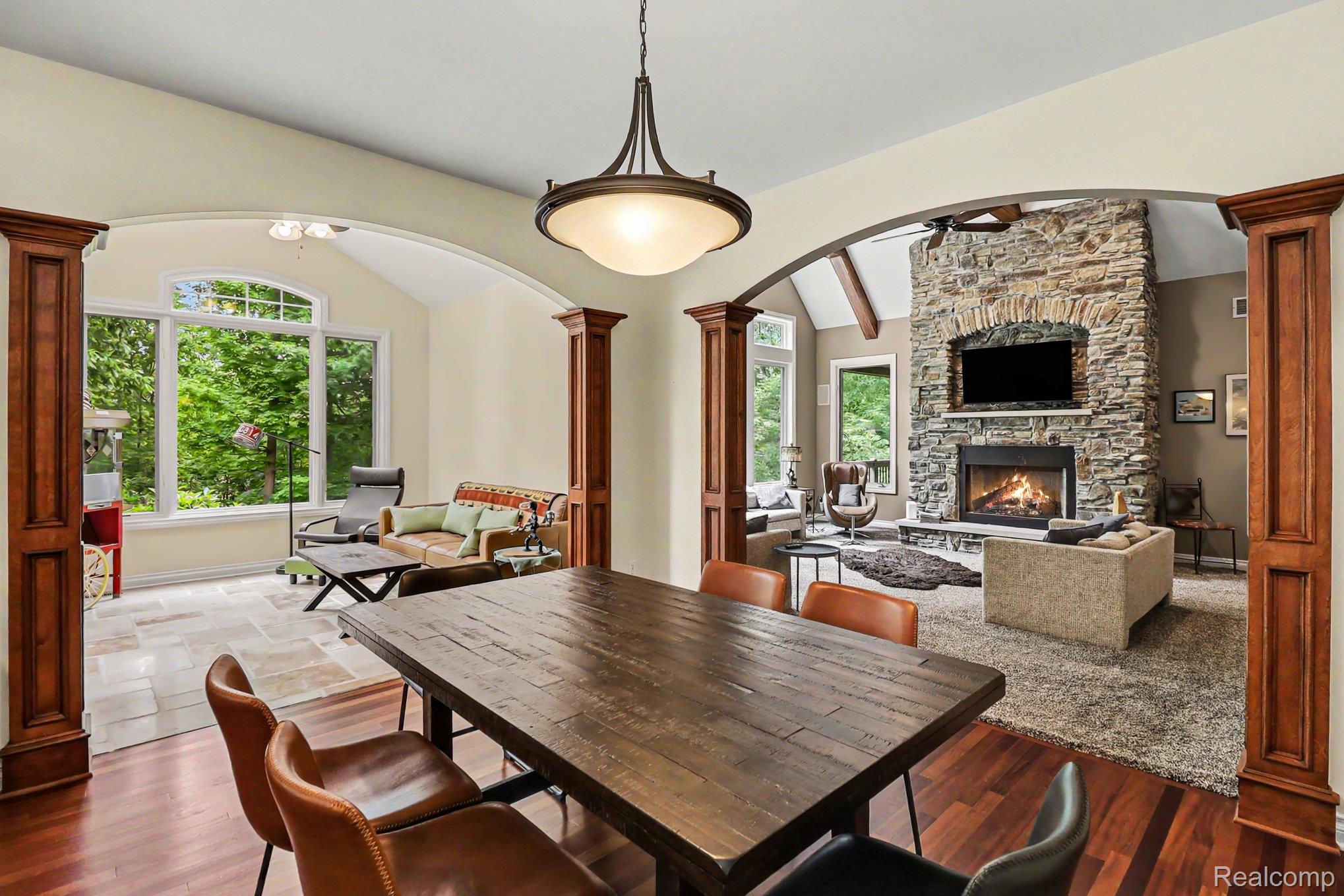 10490 Deer Ridge Trail Holly, MI 48442 - Photo 11 of 56 Dining area featuring wood-finish flooring and a contemporary chandelier