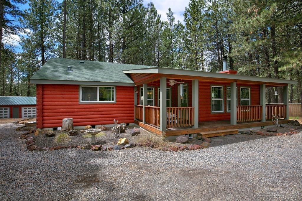 17171 Island Loop Way Bend, OR 97707 - Photo 21 of 25 a view of a house with a yard and large tree