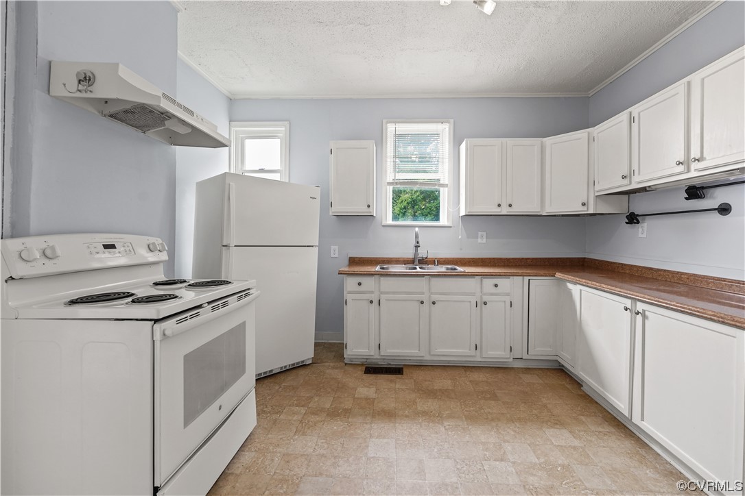 3620 Benton Avenue Richmond, VA 23222 - Photo 11 of 23 a kitchen with cabinets appliances and a window