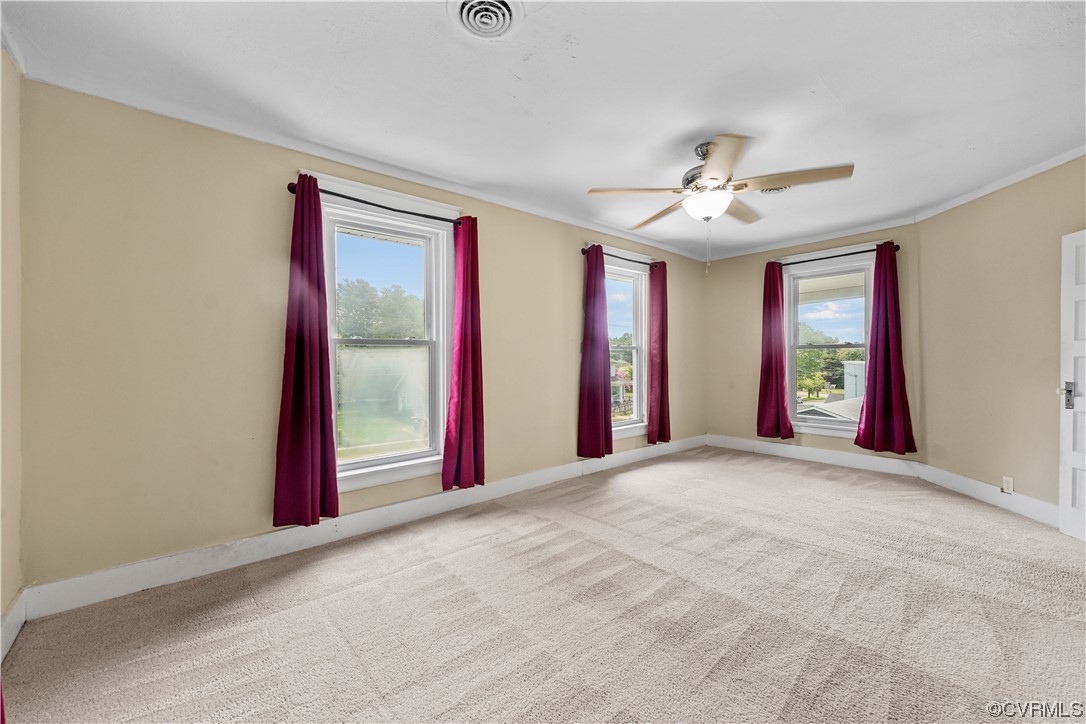 3620 Benton Avenue Richmond, VA 23222 - Photo 14 of 23 a view of an empty room with window and chandelier fan