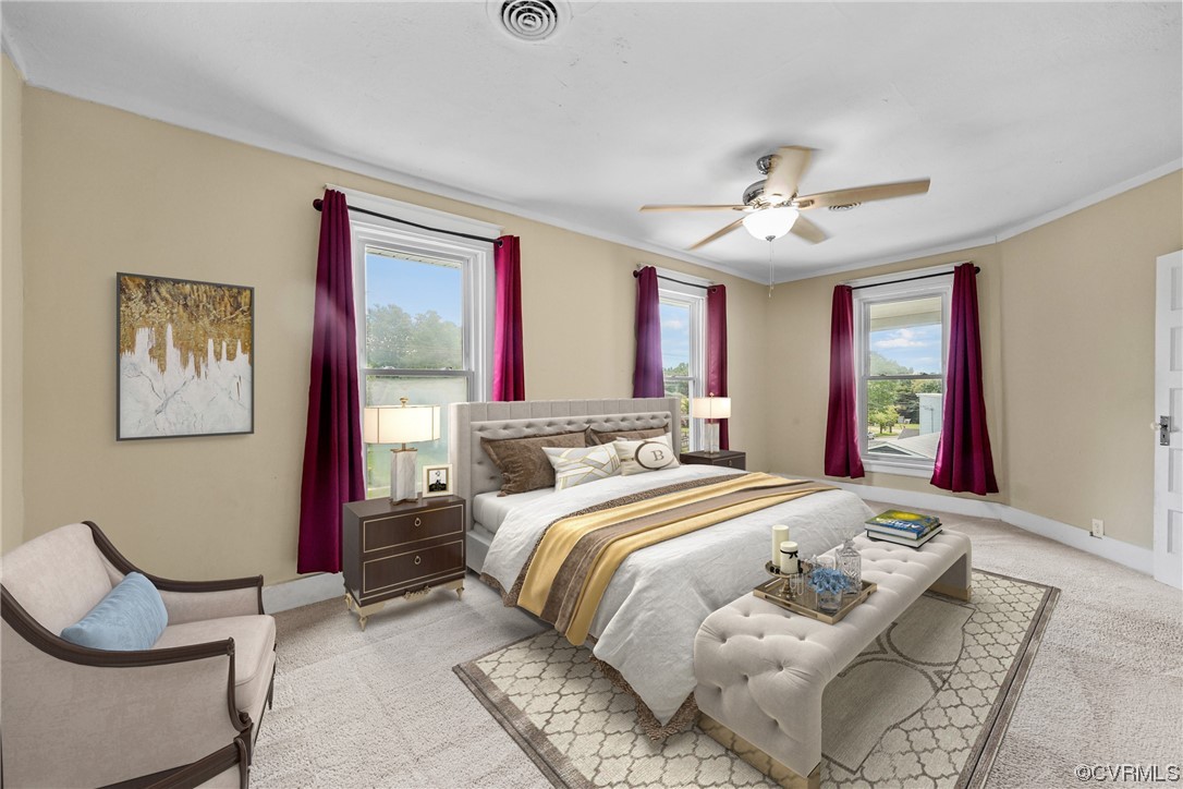 3620 Benton Avenue Richmond, VA 23222 - Photo 15 of 23 a bedroom with a bed and a chandelier