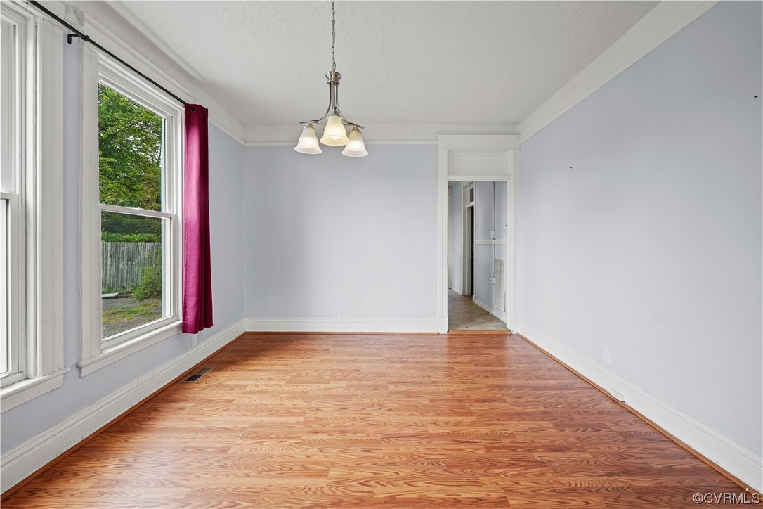 3620 Benton Avenue Richmond, VA 23222 - Photo 9 of 23 a view of empty room with wooden floor and window