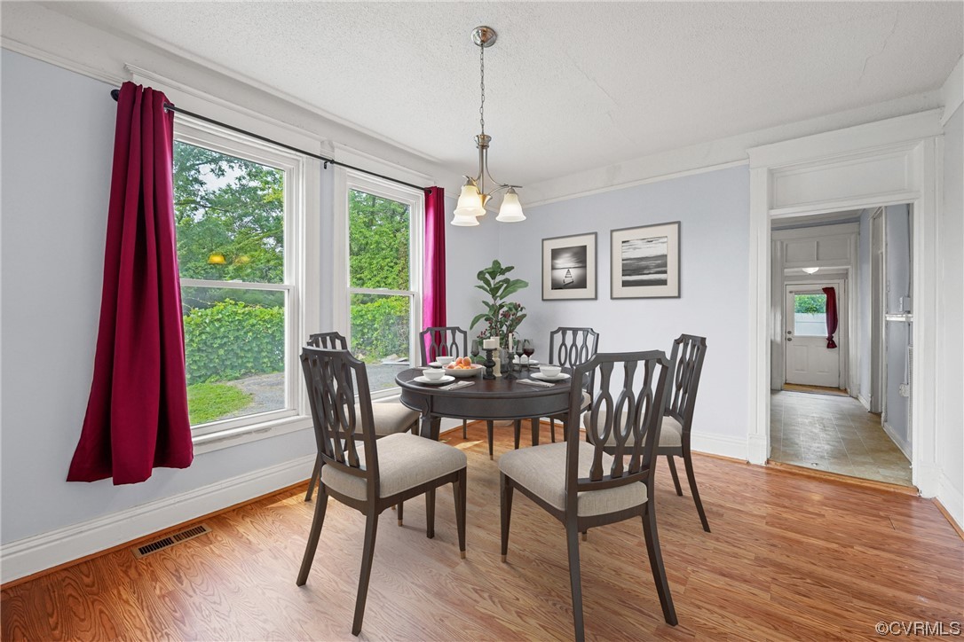 3620 Benton Avenue Richmond, VA 23222 - Photo 10 of 23 a view of a dining room with furniture window and wooden floor