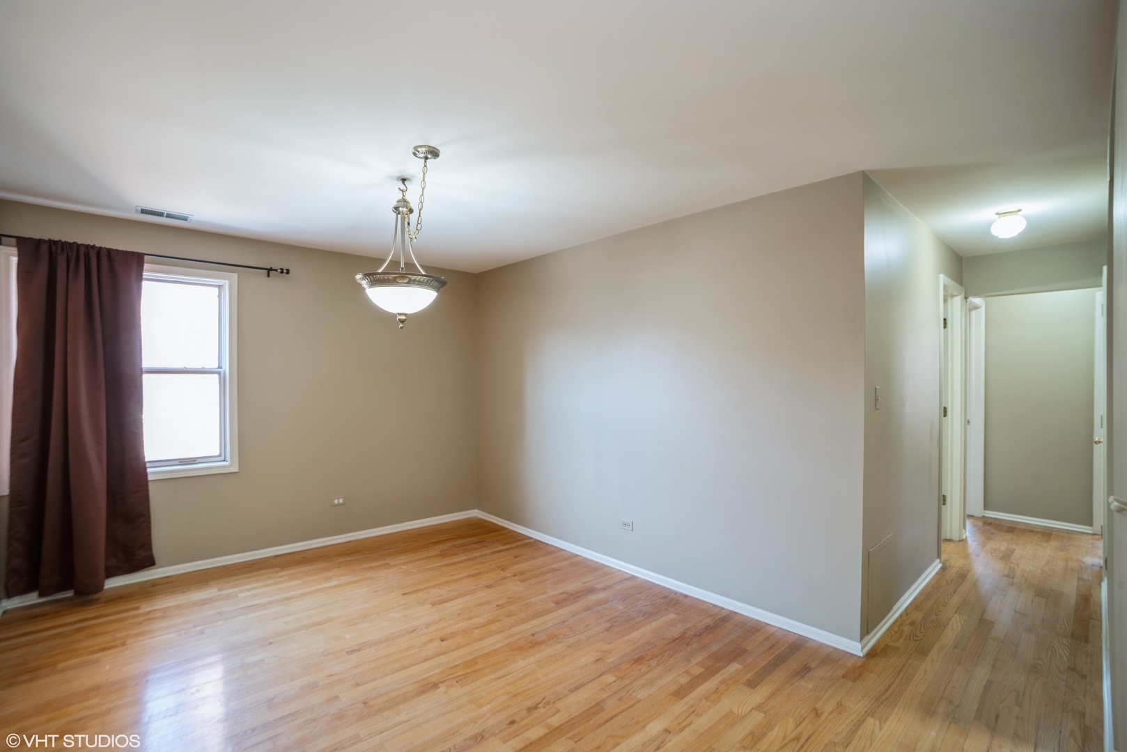 702 South Lytle Street, Unit 2N Chicago, IL 60607 - Photo 11 of 23 wooden floor in an empty room with a window