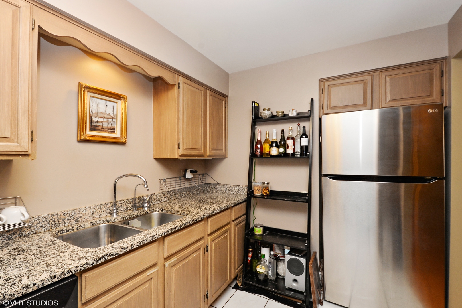 702 South Lytle Street, Unit 2N Chicago, IL 60607 - Photo 18 of 23 a kitchen with stainless steel appliances granite countertop a refrigerator and a sink