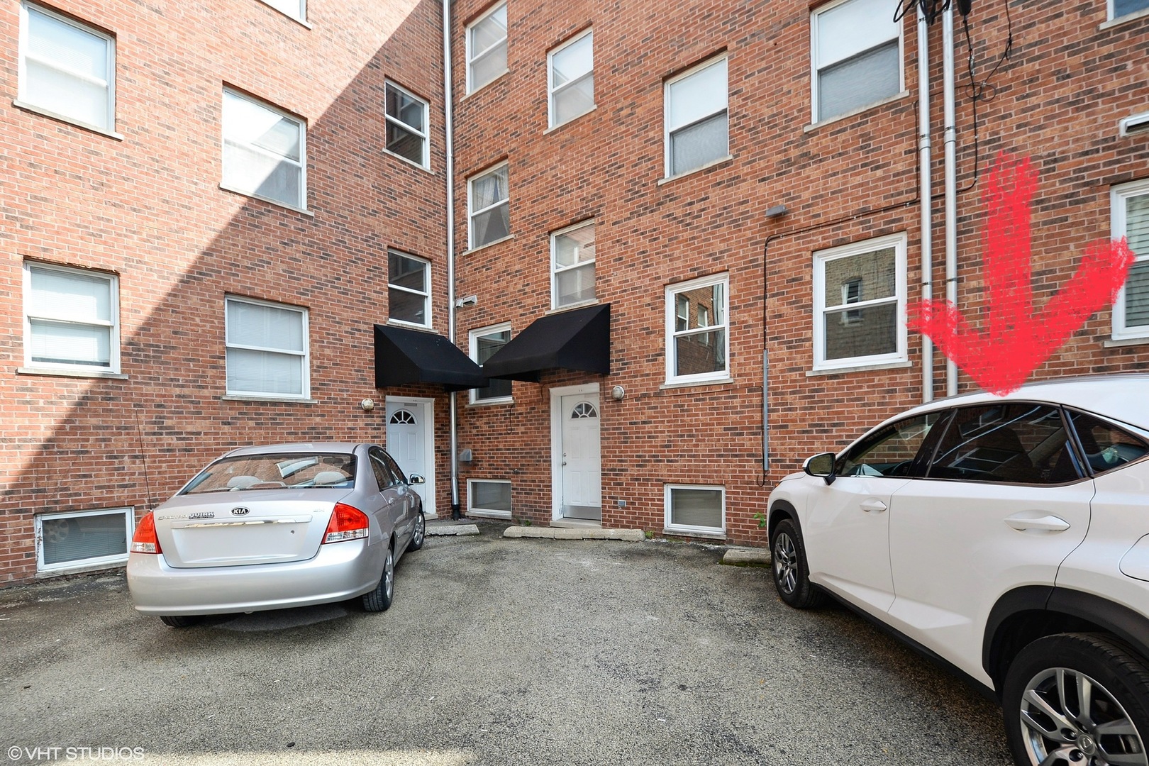 702 South Lytle Street, Unit 2N Chicago, IL 60607 - Photo 23 of 23 a front view of a house with parking space