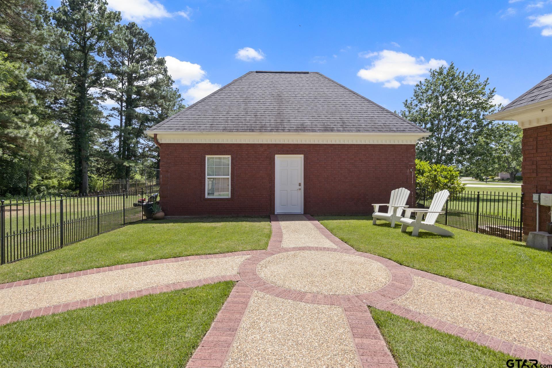 134 Private Road New Boston, TX 75570 - Photo 33 of 40 a front view of a house with a yard and trees