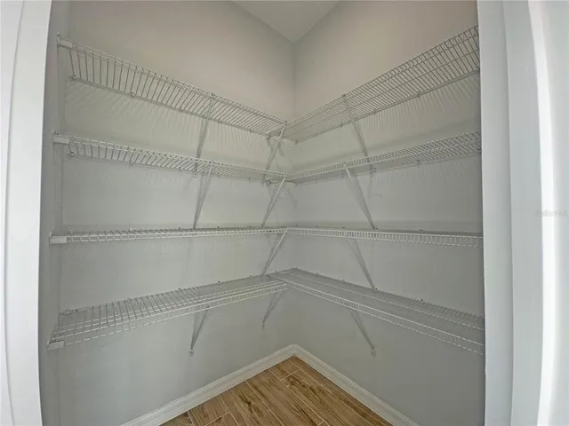 a view of a room with racks on the wall