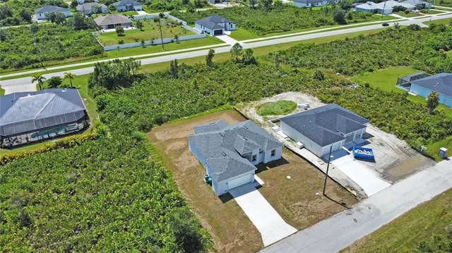 an aerial view of a house with a garden