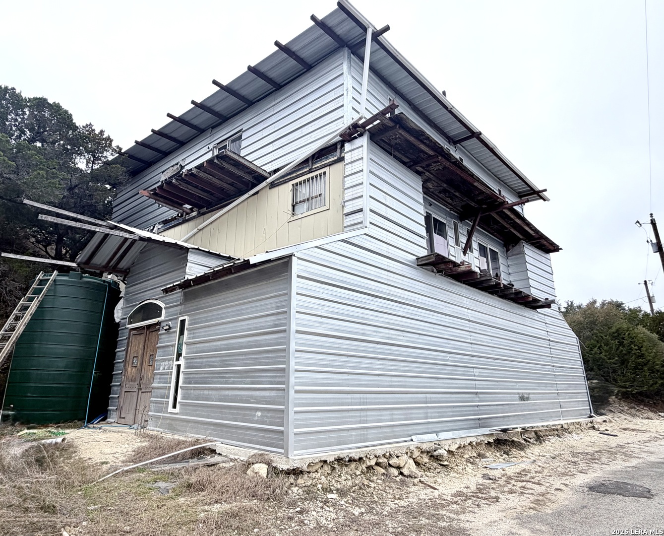 272 Plum Cove Road Lakehills, TX 78063 - Photo 11 of 11 a view of a house with a backyard